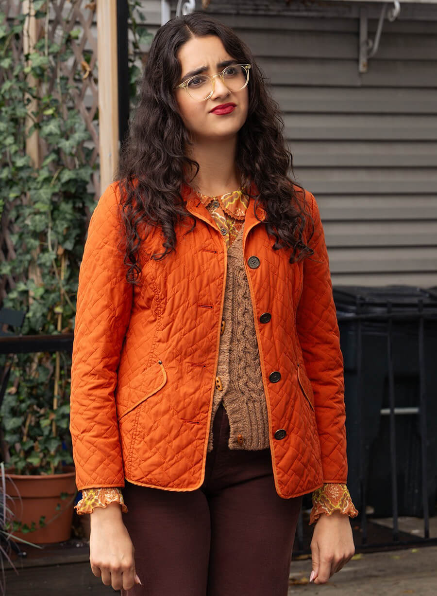 Geraldine Viswanathan Poker Face Orange Jacket